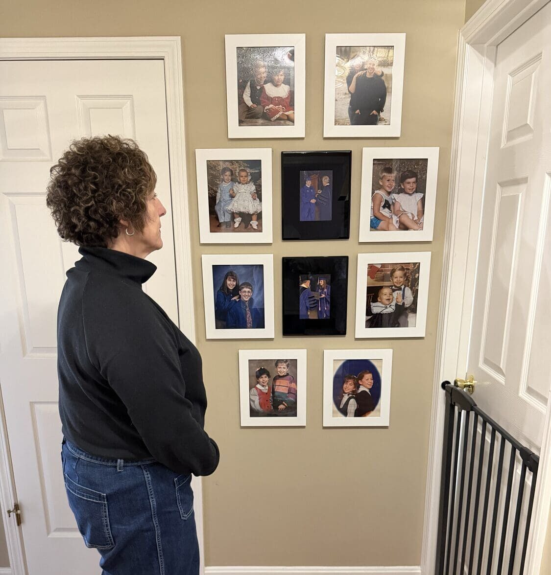 A grieving mother looking in a mirror reflecting on her identity after child loss.