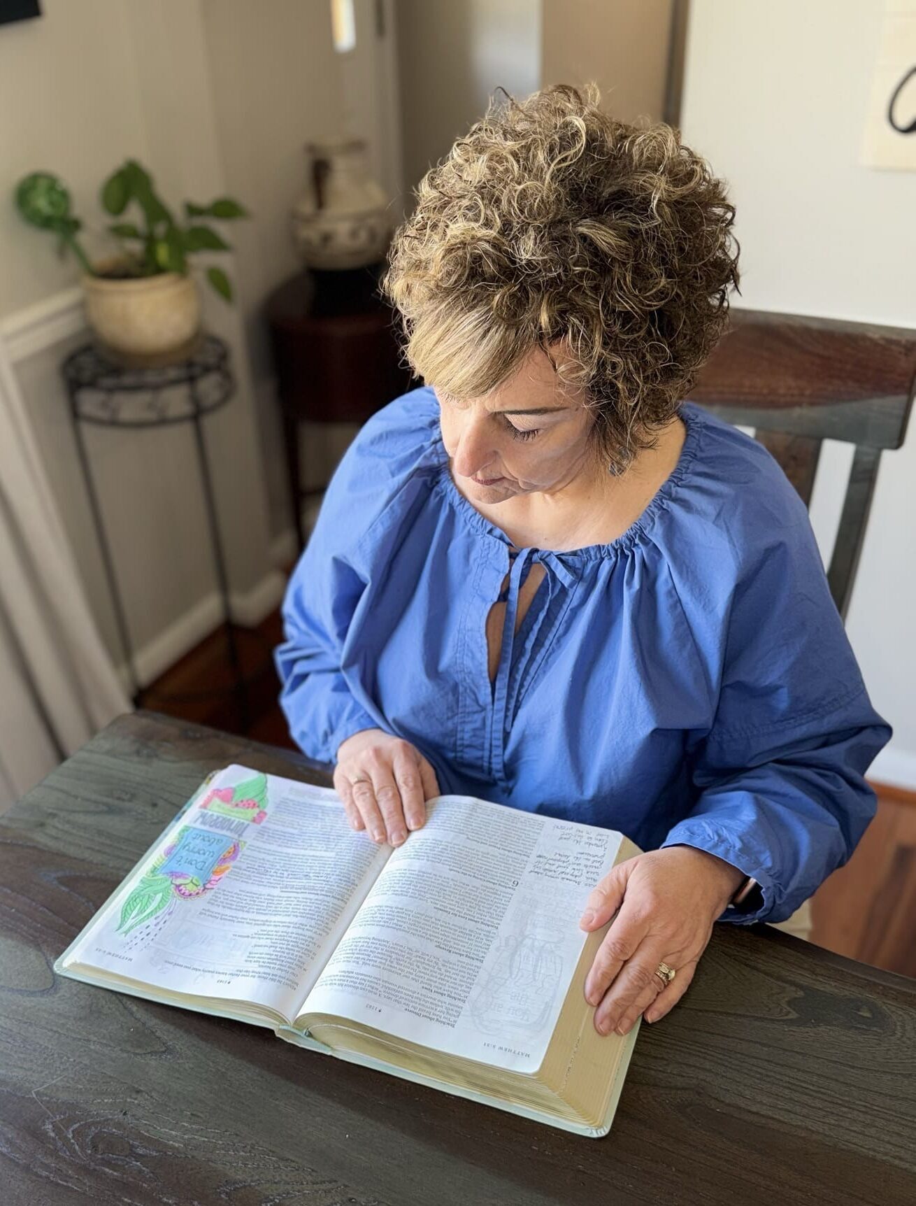 Grieving mother reading bible